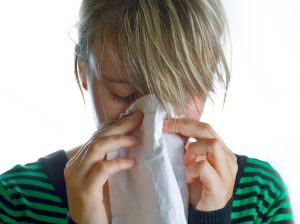 person-blowing-nose